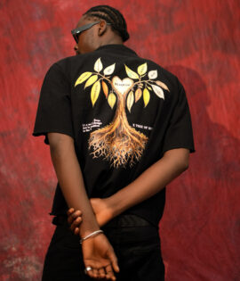 Close back view of the BLAQFAM PREMIUM black shirt showing the tree graphic with branching leaves and roots